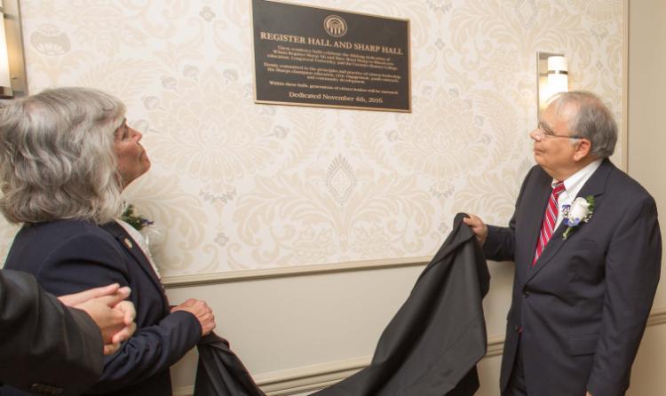 Marc Sharp and Wilma Register Sharp ’66 unveil the plaque at the dedication ceremony