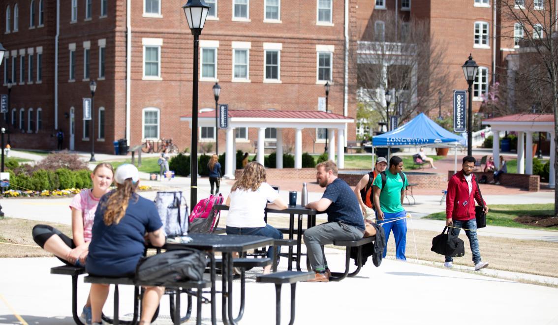 Students at picnic tables outside Upchurch