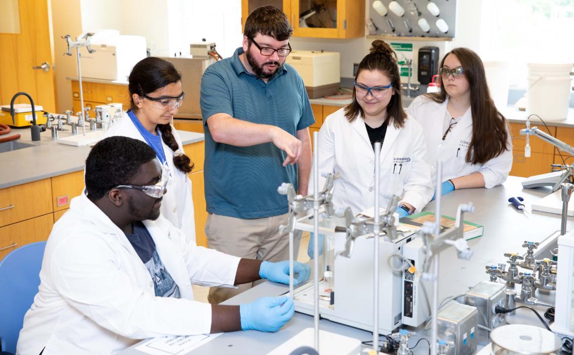 Professor and students in the a lab